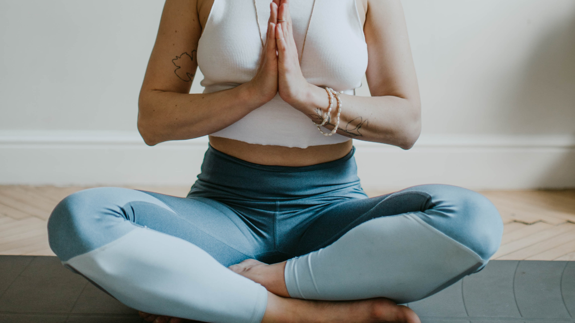 Photo of a woman sitting in a lotus position